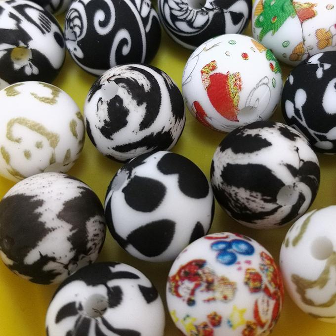 Al por mayor el silicón impreso de encargo de 12m m gotea las gotas a granel cauchutosas de Teether del silicón del estampado leopardo para el juguete de la dentición del bebé de DIY