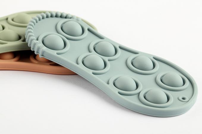 Bebé formado zapato suave orgánico Teether del silicón del juguete de la tensión de la persona agitada del silicio de 2021 niños del nuevo producto