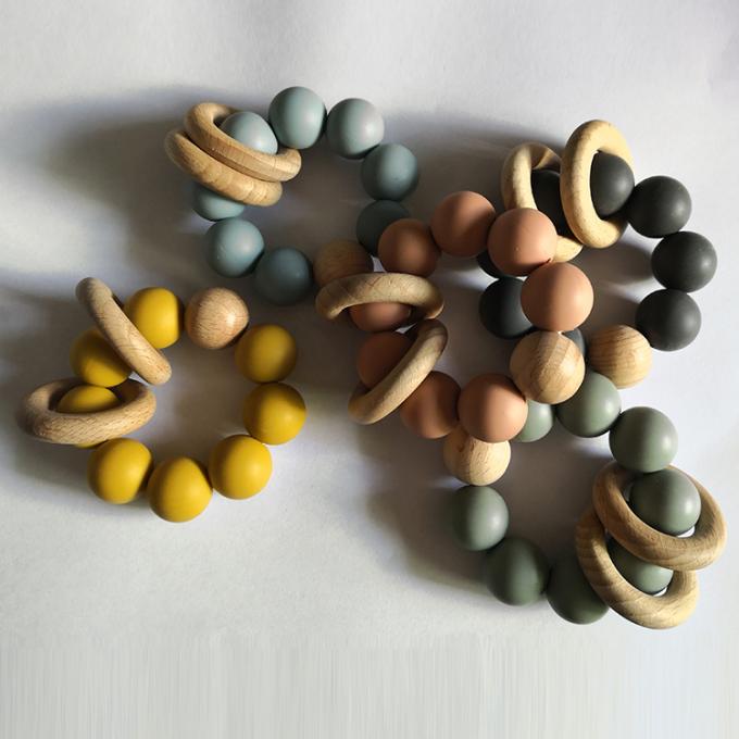 Teether de encargo del bebé del silicón de los juguetes de las gotas del silicón con la pulsera de madera 2