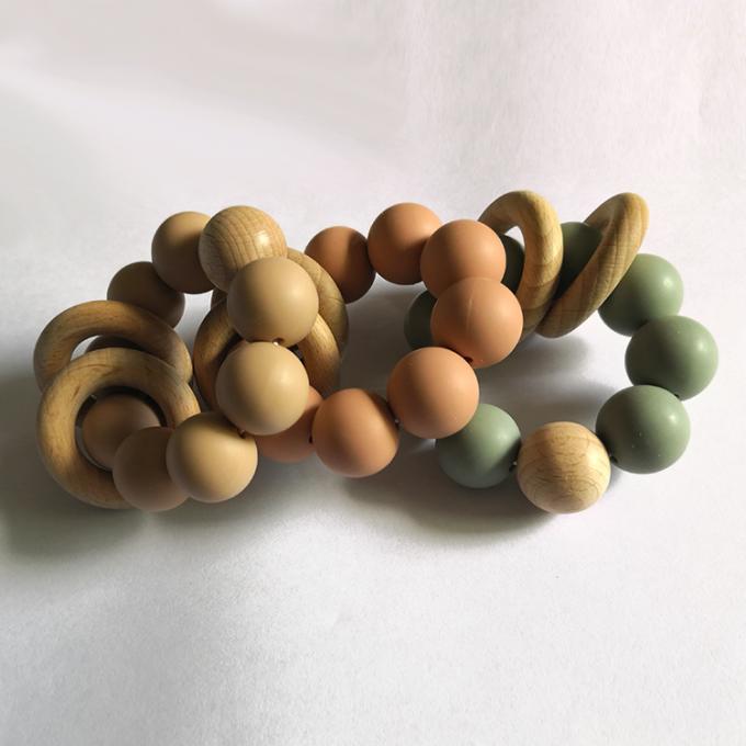 Teether de encargo del bebé del silicón de los juguetes de las gotas del silicón con la pulsera de madera 2