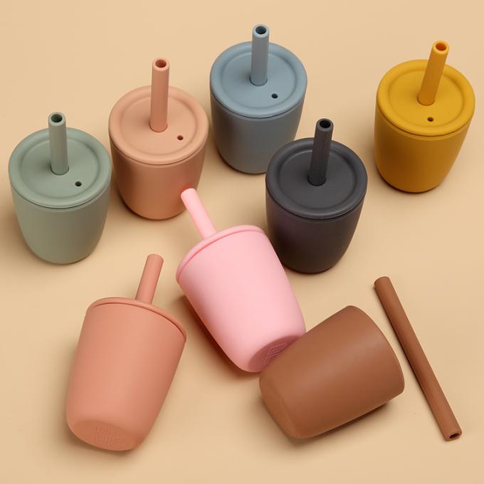 Taza sana al por mayor del agua de biberón de los niños del silicón de la categoría alimenticia con la taza del niño del entrenamiento de la tapa de Sippy